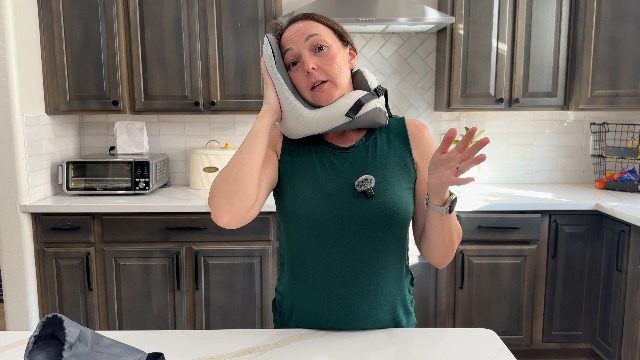 Video poster: traveler trying a ComfyNap sleeping position in her kitchen
